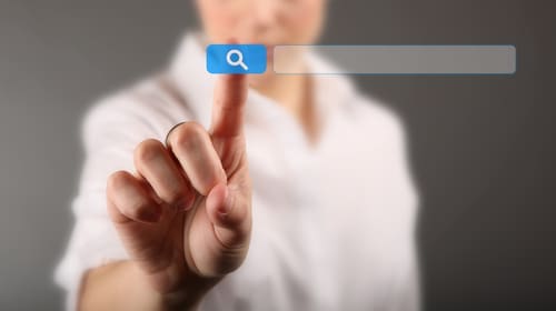 Person searching keywords on Google